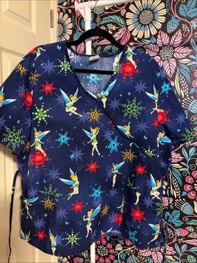 Disney Navy Blue Tinker Bell Scrub Top with Green, Red, Yellow Snow FlakeAccents